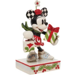 Jim Shore - Disney Traditions - Minnie With Bag And Gift -Finest Christmas Decoration 510870 Jim Shore Disney Traditions Minnie With Bag And Gift angled right 20013.1657908533